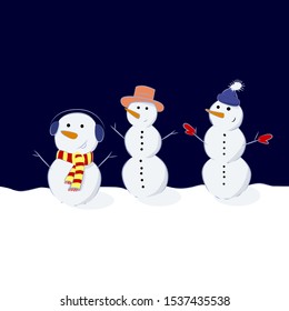 Three snowmen in different hats with carrot noses. Snowmen in funny hats.