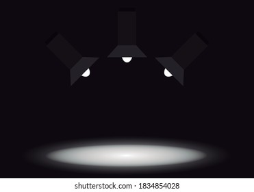 Three spotlights illuminating a stage.