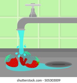 Three strawberries being cleaned and washed in a sink in a kitchen. Running tap water.