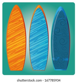 three surfboards with different colors and textures