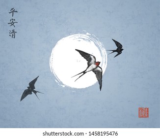 Three swallow birds on night sky background. Traditional Japanese ink wash painting sumi-e with swallows and the moon. Hieroglyphs - peace, tranquility, clarity