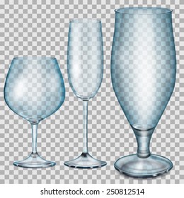 Three transparent blue empty glass goblets for cognac, champagne and beer