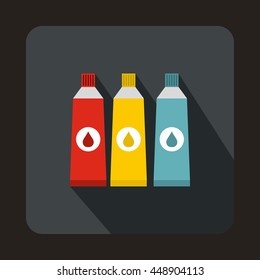 Three tubes with colorful paint icon in flat style on a gray background