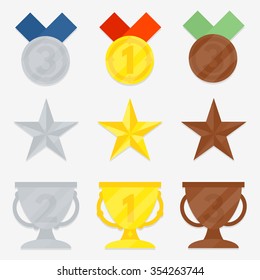 Three variations of awards. Star, cup, medal. Gold, silver, bronze. The first, second, third place.