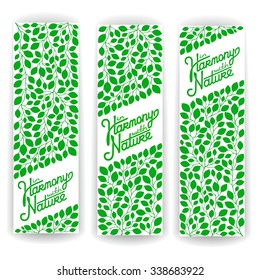 Three vector banner of branches with green leaves and calligraphy lettering - In harmony with nature. EPS 8