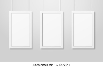 Three Vector Realistic Modern Interior White Blank Wooden Poster Picture Frame Set Hanging on the Ropes on White Wall Mock-up. Empty Poster Frames Design Template for Mockup, Presentation