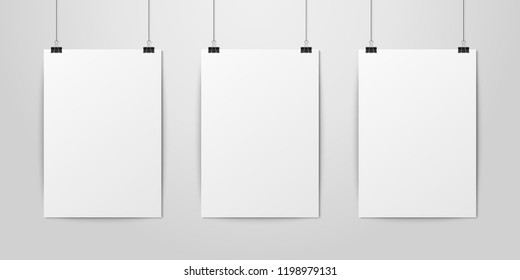 Three Vector Realistic White Blank Vertical A4 Paper Poster Hanging on a Rope with Binder Clip Set on White Wall mock-up. Empty Poster Design Template for Mockup