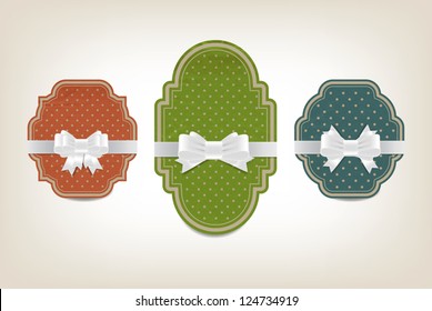 Three vector vintage style cardboard banners with dotted patterns and white festive silky bow knots