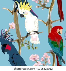 Three vibrant cockatoo parrots are sitting on tree branches in delicate pink flowers seamless vector illustration. Picture with exotic bird on light blue background. Endless pattern. EPS 10