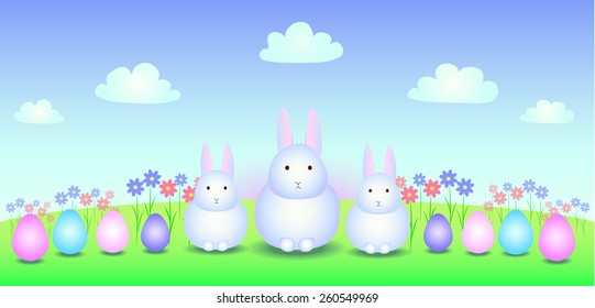 Three white bunny in the meadow with eggs and flowers