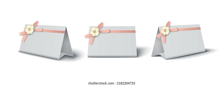 Three white cardboard place cards decorated with pink bow and flower realistic mockup isolated vector illustration