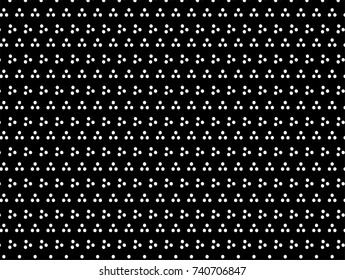 Three white dots grouped on the black background