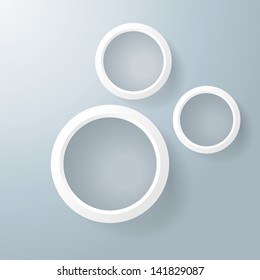 Three white rings with shadows on the grey background. Eps 10 vector file.