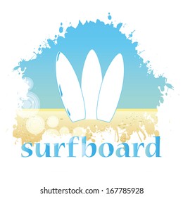 three white surfboards in the sand with the sky as background