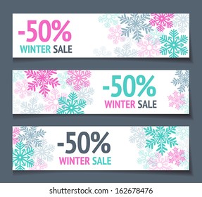 Three winter sales banners with snowflakes.