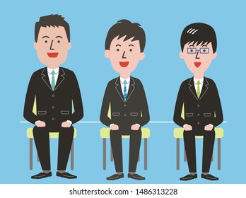 Three young men in suits tense at group interview