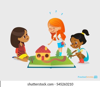 Three young smiling girls sit on floor, talk and play with pop-up book. Children's entertainment and preschool educational activity concept. Vector illustration for website banner, advertisement.