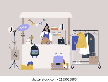 A thrift shopping concept, a Sunday market stand with used clothes and accessories