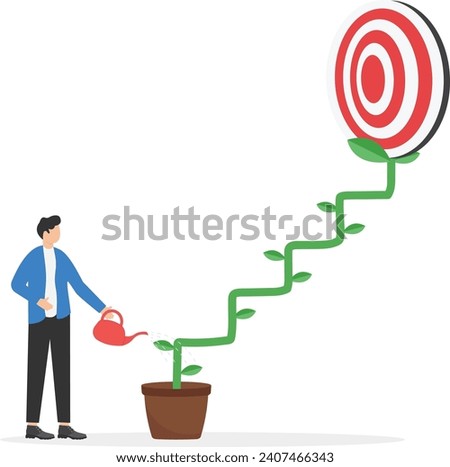 Through the laptop Businessman watering seedling growing darts in flower pot plant growing up as stair. Growth step or career path. Focus on global business goals.

