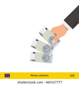 Throwing three euro. Euro banknote.