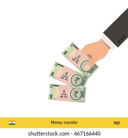 Throwing three rupee. Indian rupee banknote.