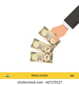 Throwing three rupee. Indian rupee banknote.
