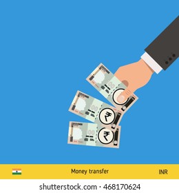 Throwing three rupee. Indian rupee banknote.