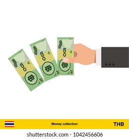 Throwing three  Thai baht. Thai baht banknote.
