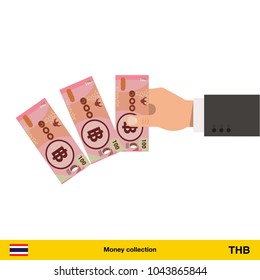 Throwing three Thai baht. Thai baht banknote.

