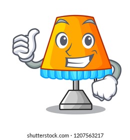 Thumbs up cartoon table lamp beside in bed
