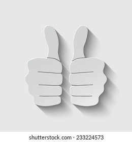 thumbs up icon with shadow on a grey background