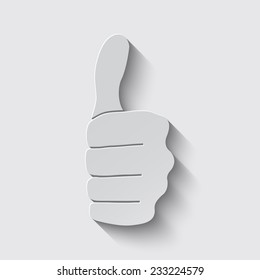 thumbs up icon with shadow on a grey background