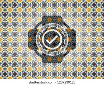 tick icon inside arabic badge. Arabesque decoration.