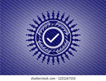 tick icon inside badge with jean texture