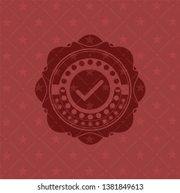 tick icon inside badge with red background