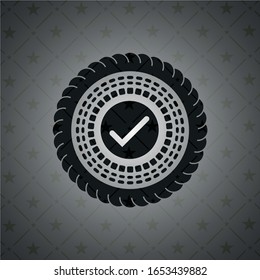 tick icon inside black badge