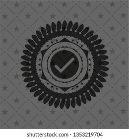 tick icon inside black emblem