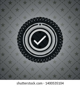 tick icon inside black emblem