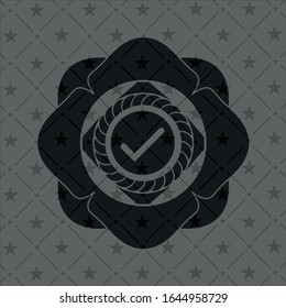 tick icon inside black emblem
