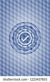 tick icon inside blue badge with geometric pattern.