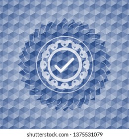 tick icon inside blue hexagon emblem.