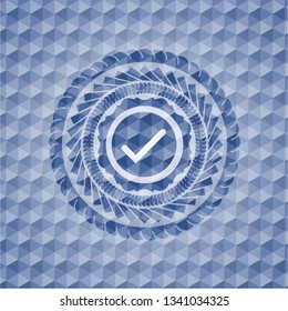 tick icon inside blue polygonal emblem.