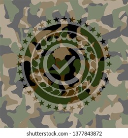 tick icon inside camo emblem