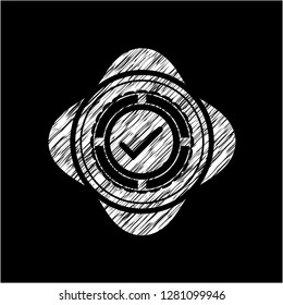 tick icon inside chalk emblem