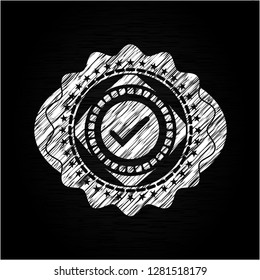 tick icon inside chalk emblem