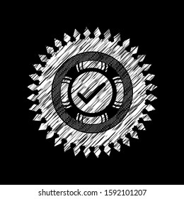 tick icon inside chalk emblem