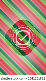 tick icon inside christmas colors style badge.