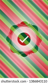 tick icon inside christmas style emblem.