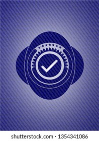 tick icon inside emblem with jean high quality background