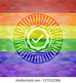 tick icon inside emblem on mosaic background with the colors of the LGBT flag